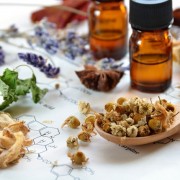 herbs and essential oils on science sheet